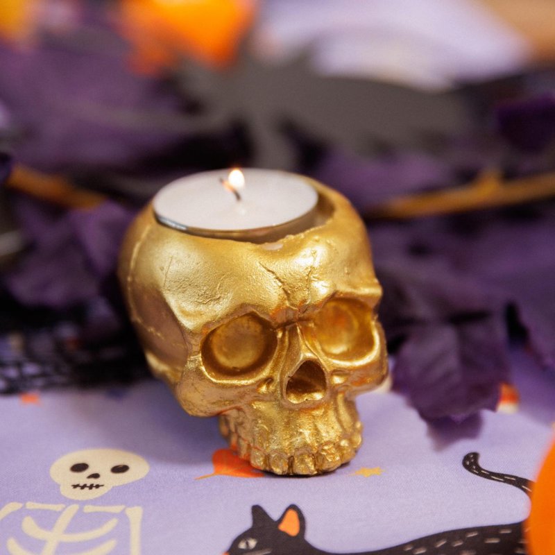 Castiçal Caveira Resina Dourada 4x3,8cm